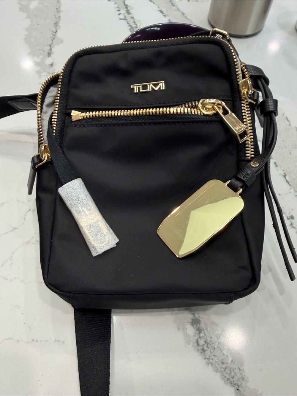 Tumi Black Crossbody Bag with Gold Hardware